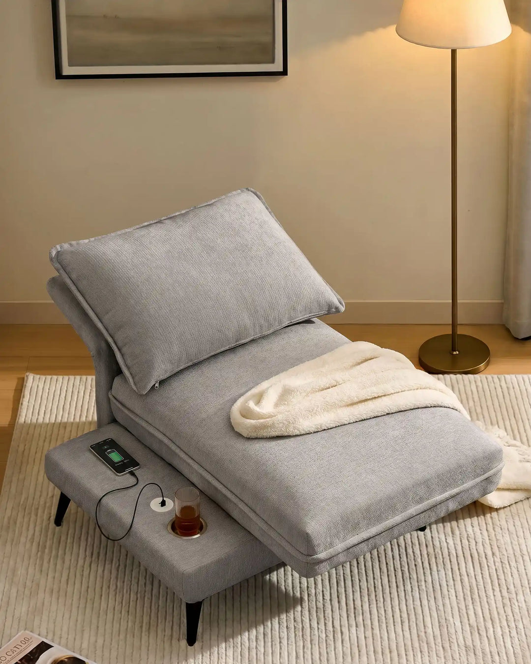 the grey Hudson modular sofa (left) with fully reclined backrest, transforming into a lounge sofa in living room cornerue 