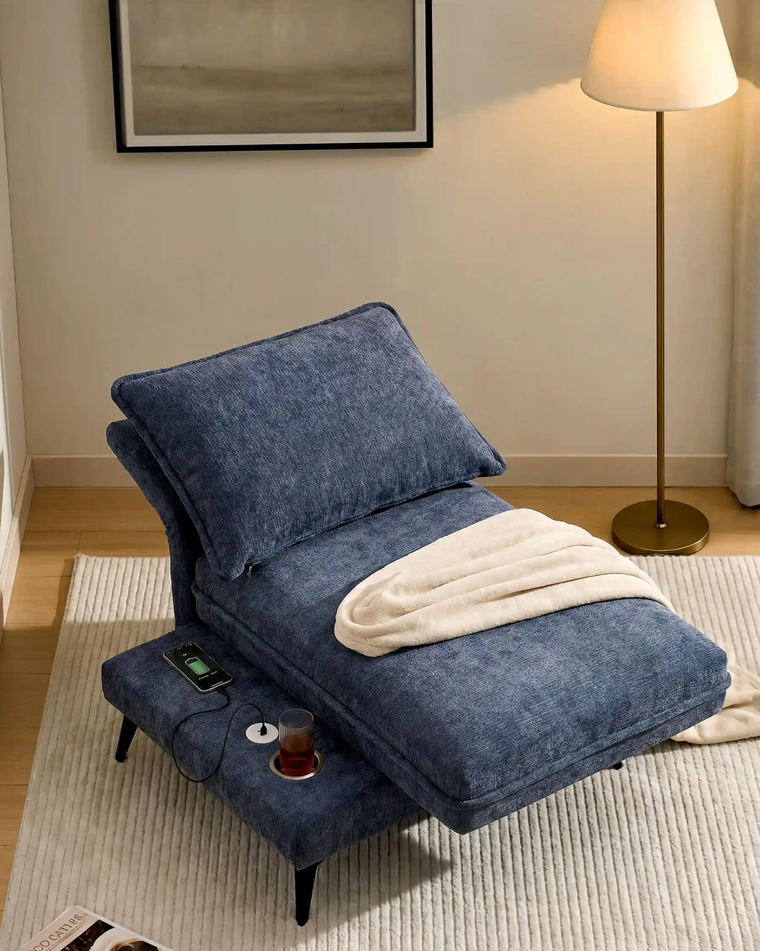 the blue Hudson modular sofa (left) with fully reclined backrest, transforming into a lounge sofa in living room cornerue 