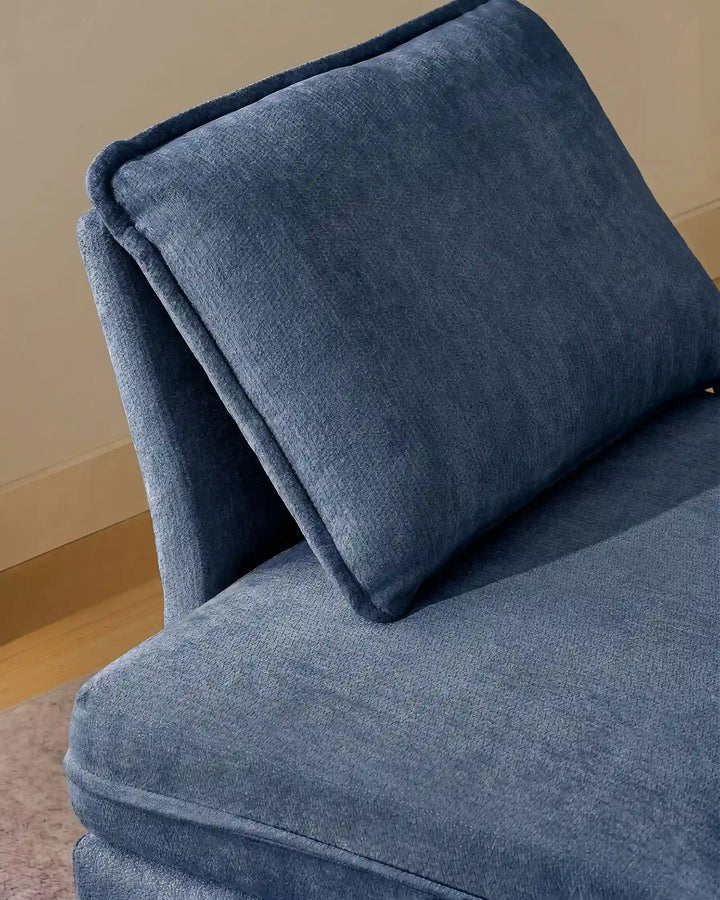 Close-up of blue Hudson modular sofa (left) backrest cushions showing plush comfort and soft chenille fabric