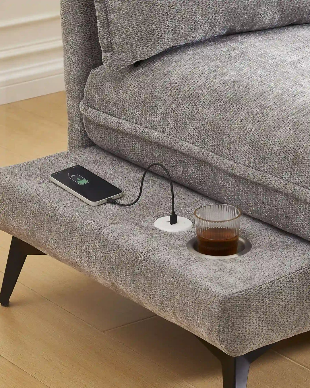 Close-up of grey Hudson modular sofa (left) USB port and integrated cup holder