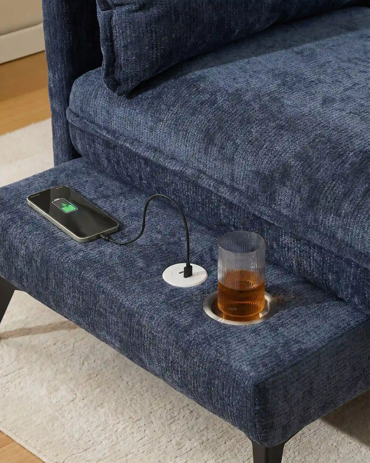 Close-up of blue Hudson modular sofa (left) USB port and integrated cup holder