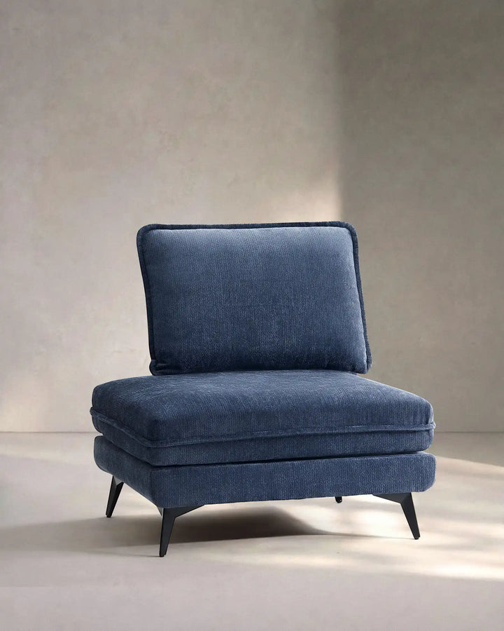 Hudson blue modular sofa (left) on white background showing side view