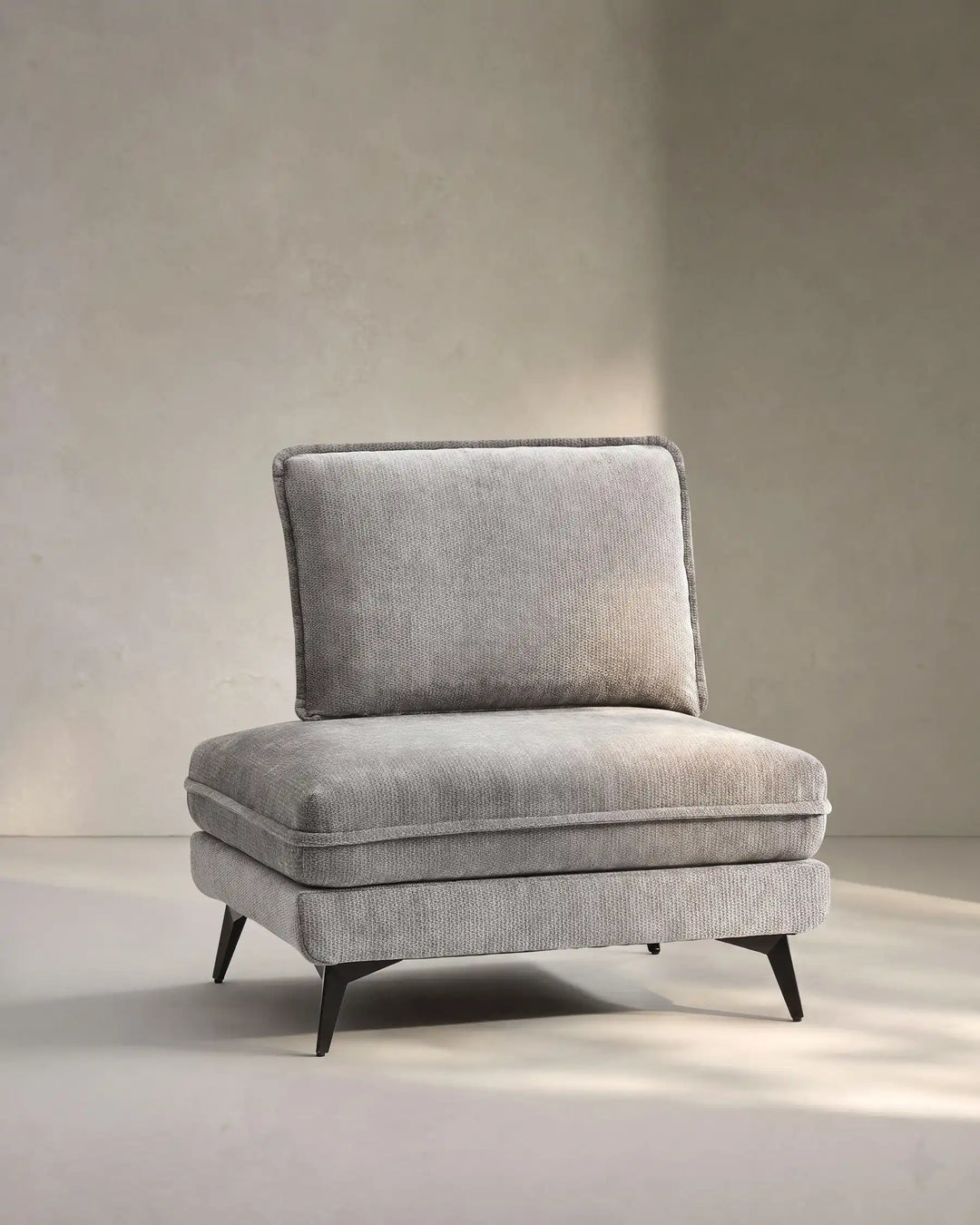 Hudson grey modular sofa (left) on white background showing side view