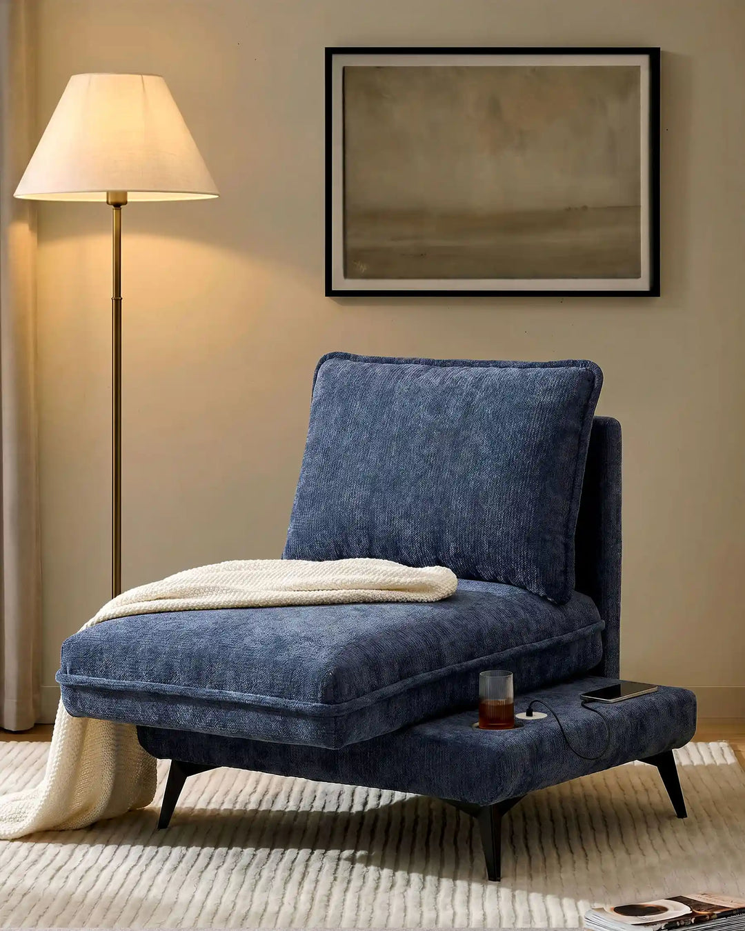 Hudson blue modular sofa (right) in living room corner with extended seat showing USB port and built-in cup holder