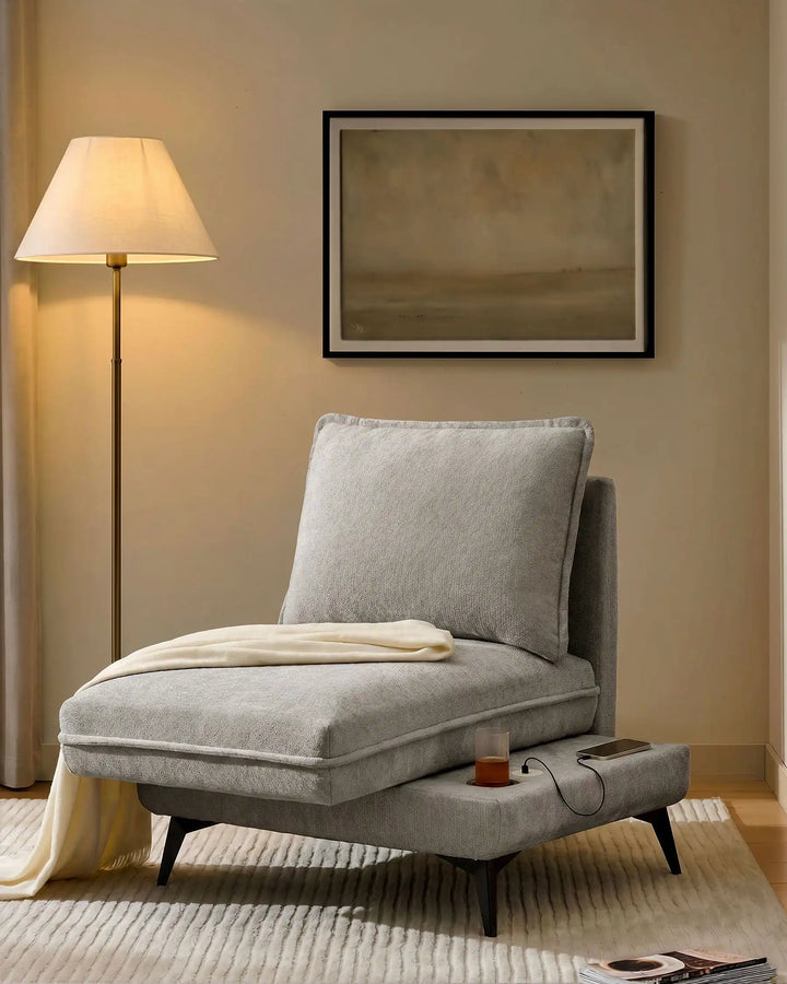 Hudson grey modular sofa (right) in living room corner with extended seat showing USB port and built-in cup holder