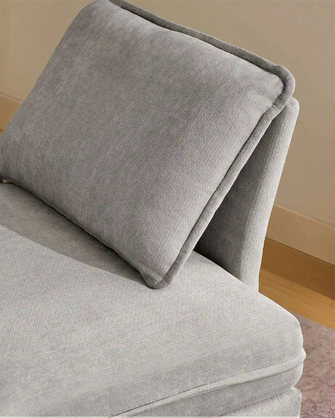 Close-up of blue Hudson modular sofa (right) backrest cushions showing plush comfort and soft chenille fabric