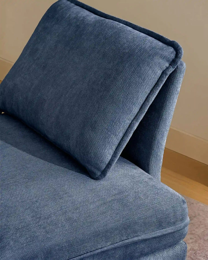 Close-up of blue Hudson modular sofa (right) backrest cushions showing plush comfort and soft chenille fabric