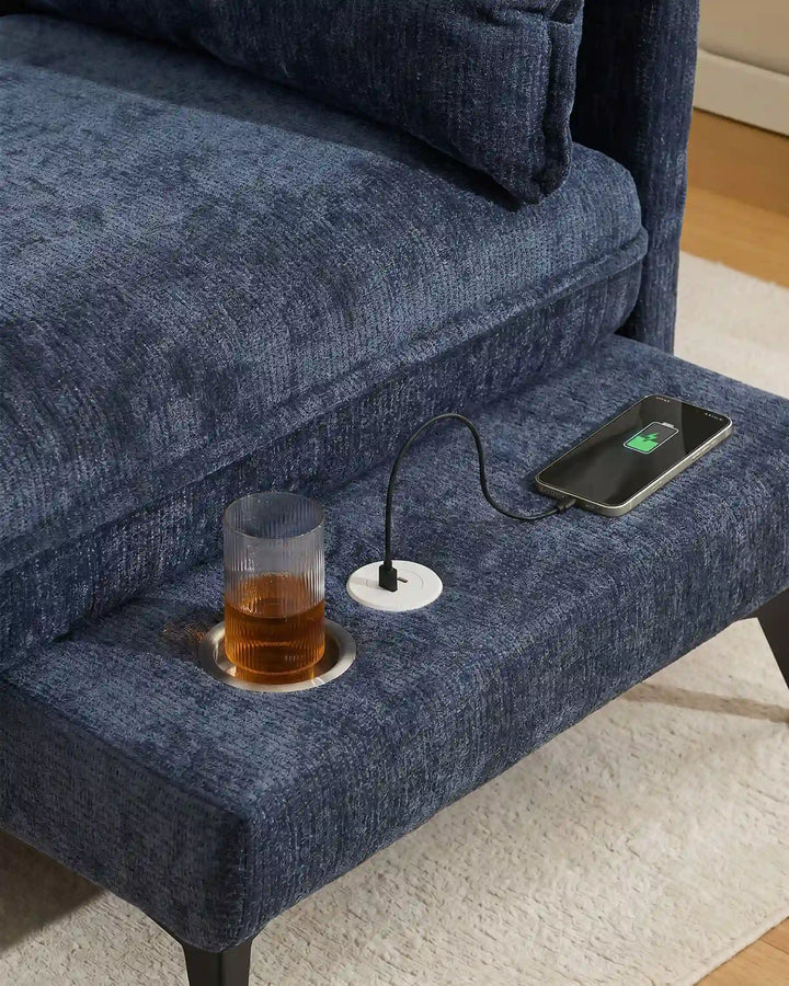 Close-up of Hudson blue modular sofa (right) USB port and integrated cup holder