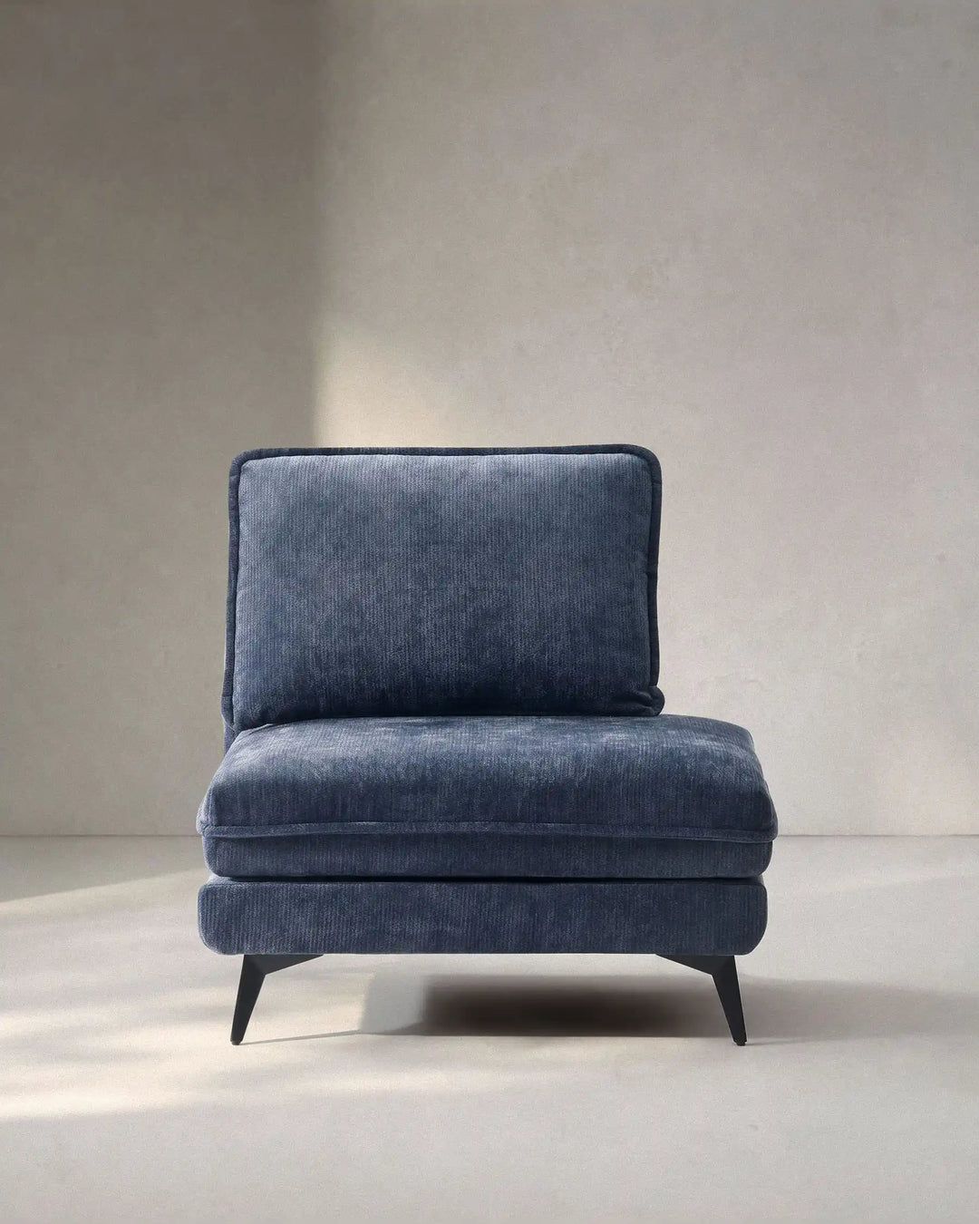 Hudson blue modular sofa (right) on white background showing front view