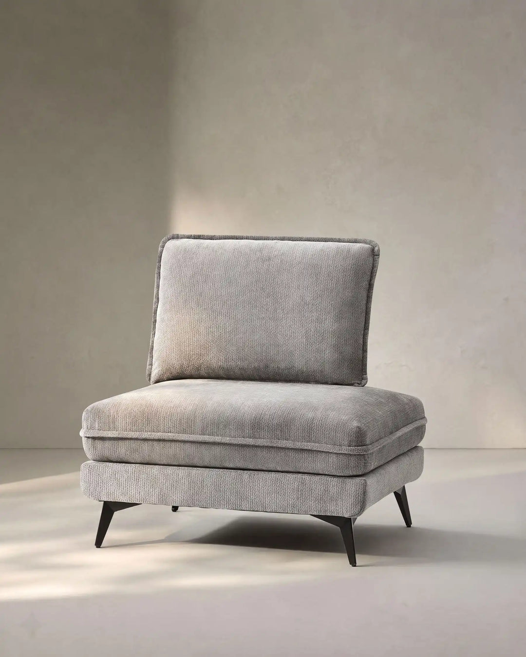 Hudson greymodular sofa (right) on white background showing side view