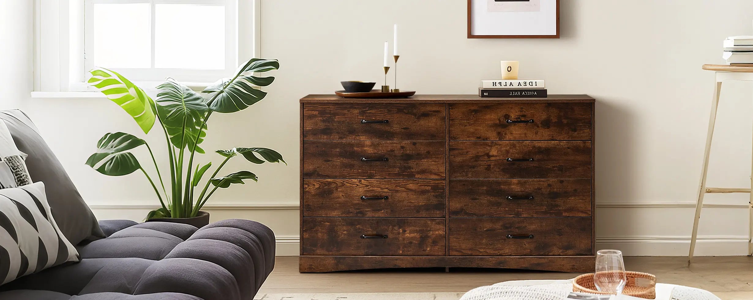 Kamai rust brown 8-drawer chest in airy living room with sofa and plants, by window, styled with decorative items.