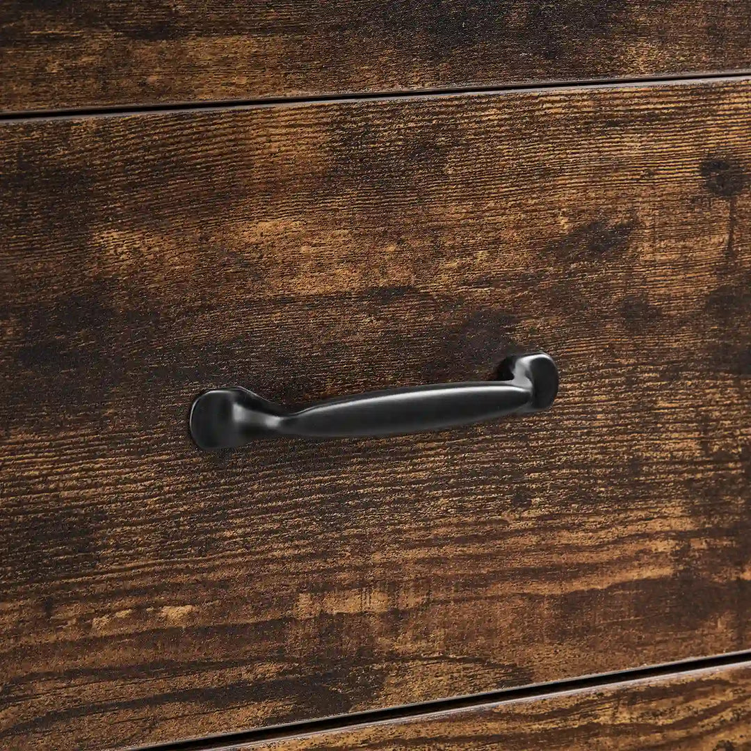 Close-up of black curved metal drawer handle on Kamai rust brown chest of drawers