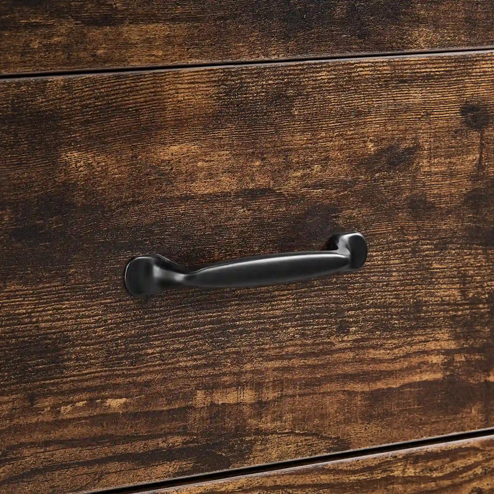Close-up of black curved metal drawer handle on Kamai rust brown chest of drawers