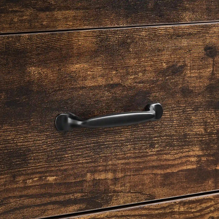 Close-up of black curved metal drawer handle on Kamai rust brown chest of drawers