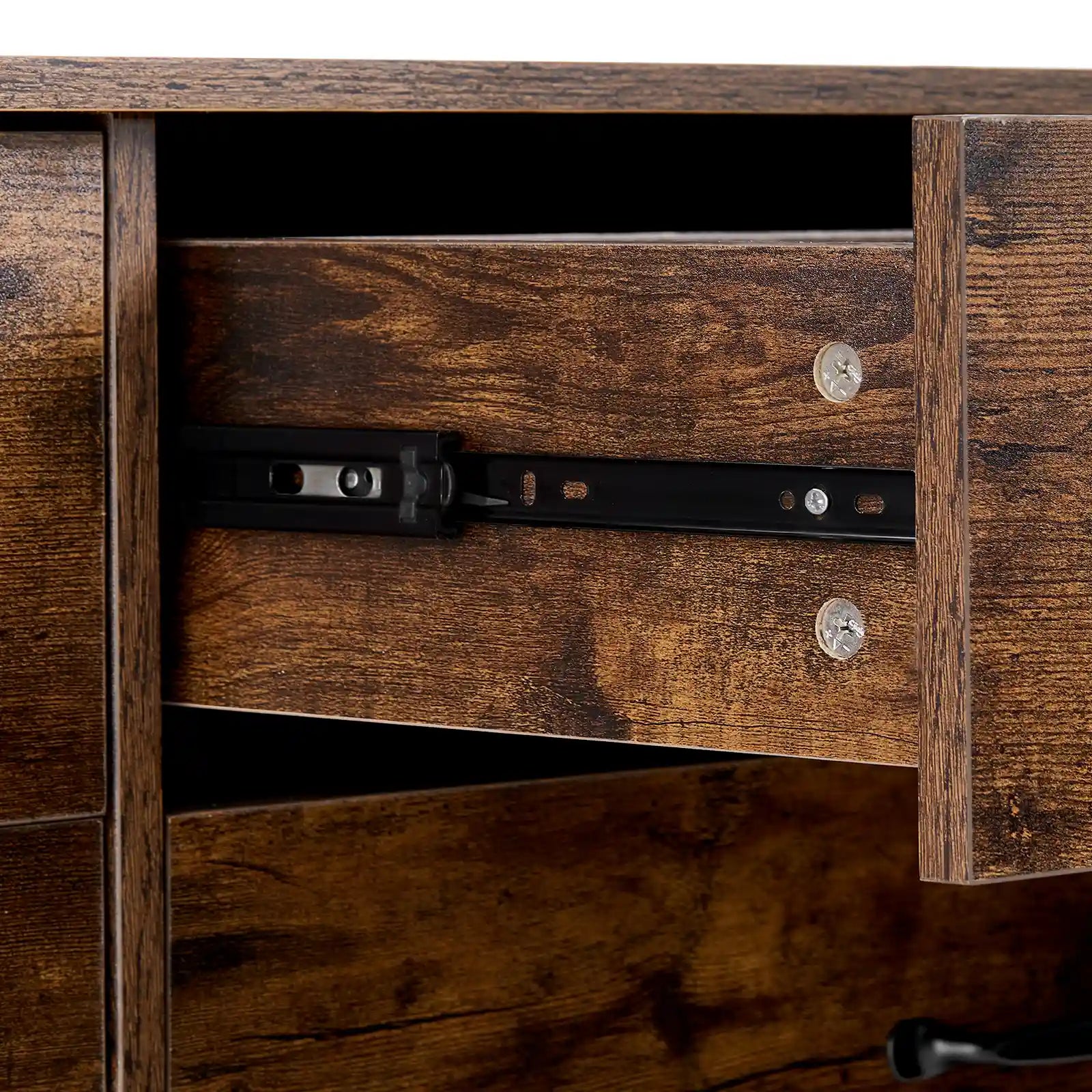 Detail of smooth black metal drawer slides on Kamai rust brown chest of drawers.