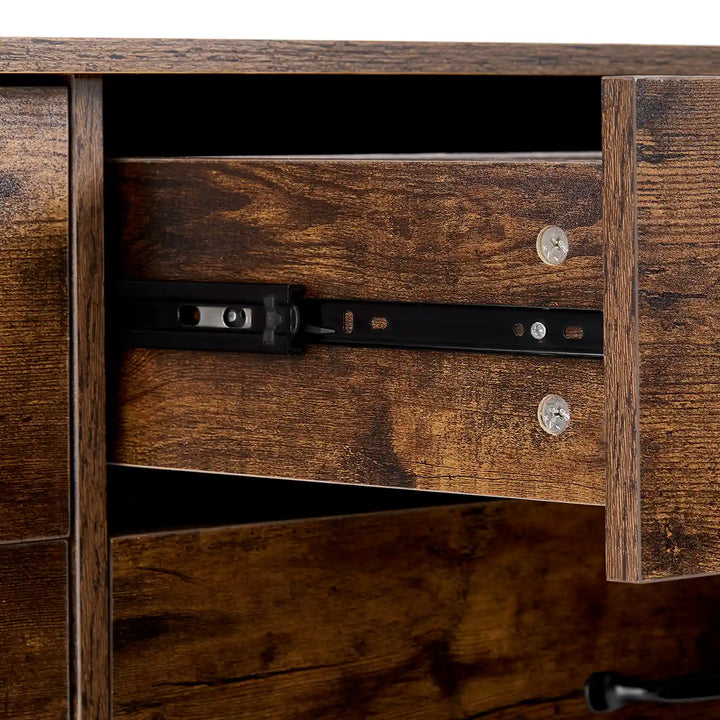 Detail of smooth black metal drawer slides on Kamai rust brown chest of drawers.
