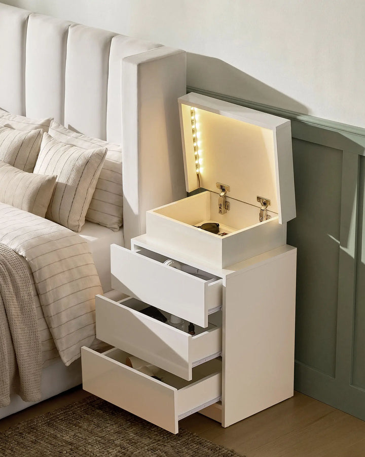 White Kumar LED bedside table with three drawers open, displaying spacious bedroom storage and LED lighting