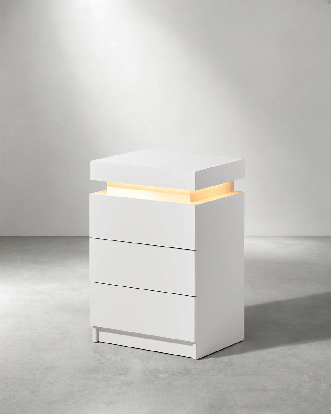 Side view of white Kumar LED light bedside table with modern high gloss design
