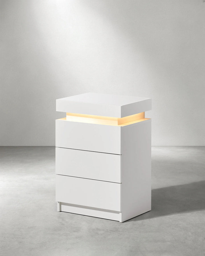 Side view of white Kumar LED light bedside table with modern high gloss design
