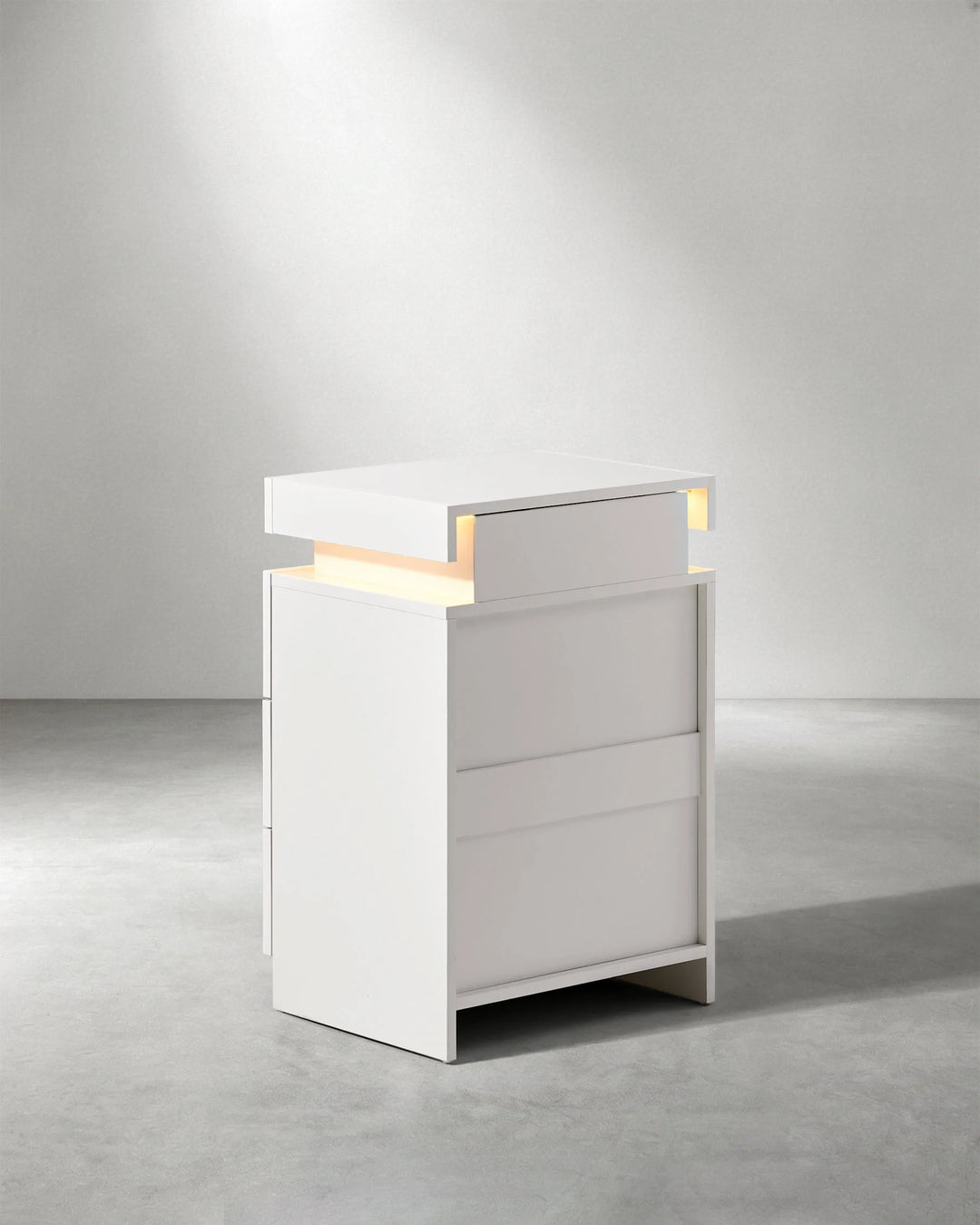 Rear angled view of white Kumar LED bedside cabinet, contemporary LED nightstand for modern bedrooms