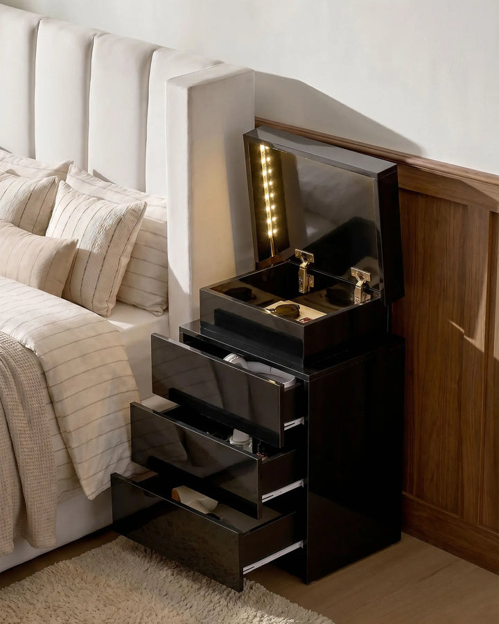 Black Kumar LED bedside table with three drawers open, showing bedroom storage space and integrated LED lighting