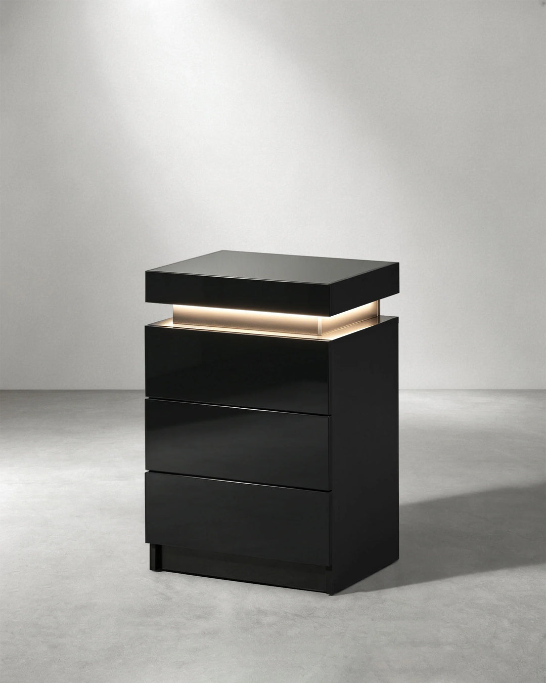 Side view of black Kumar LED light bedside table with contemporary high gloss finish