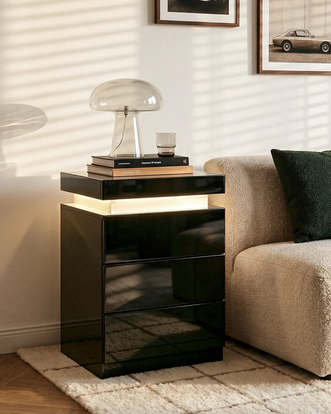 Black high gloss smart bedside table in a luxury bedroom setting with a designer lamp.