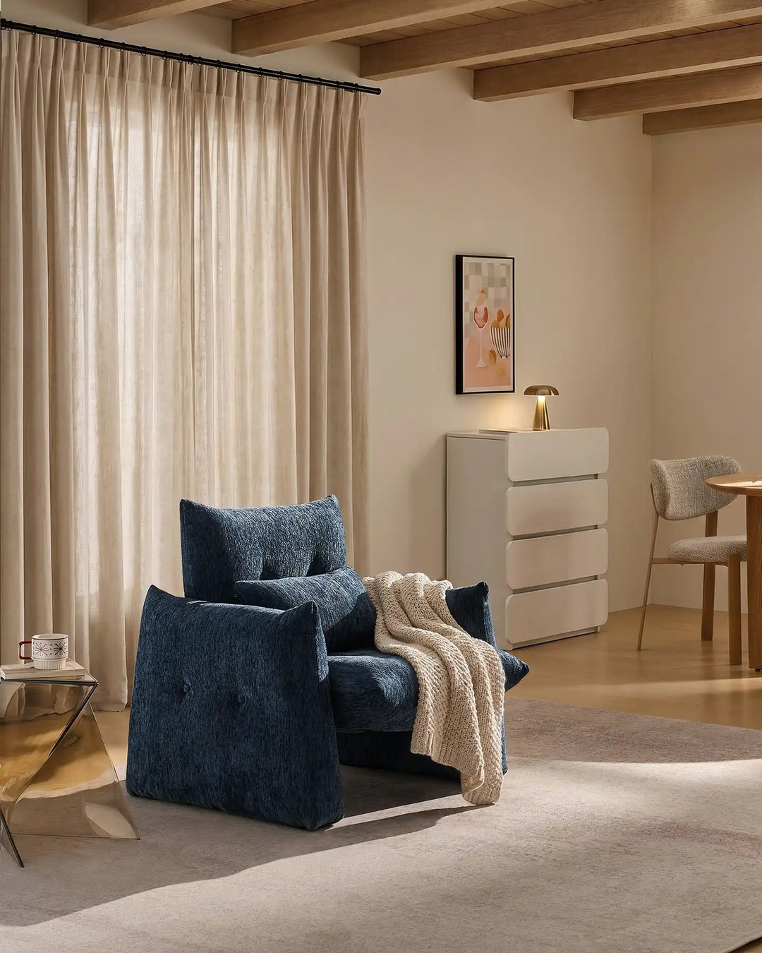 Navy Blue Kumo Accent Chair used as an occasional chair beside a sofa in a contemporary living room
