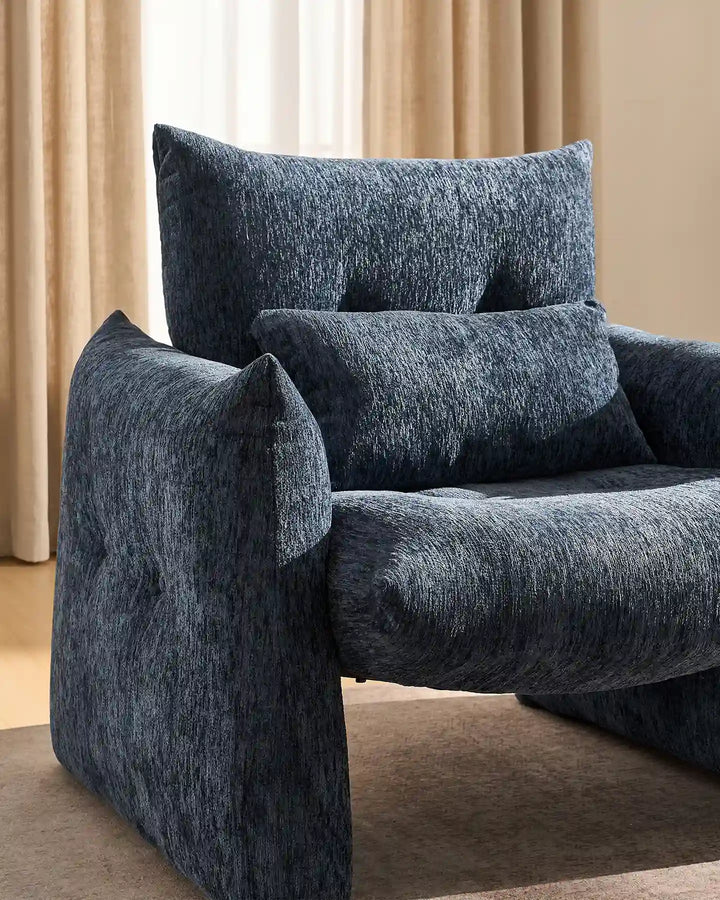 Close-up of the Navy Blue Kumo Accent Chair with rounded armrests and a thick padded chenille seat