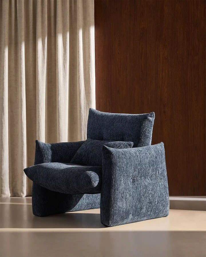 Side profile of the Navy Blue Kumo Accent Chair featuring oversized comfort and rounded modern styling