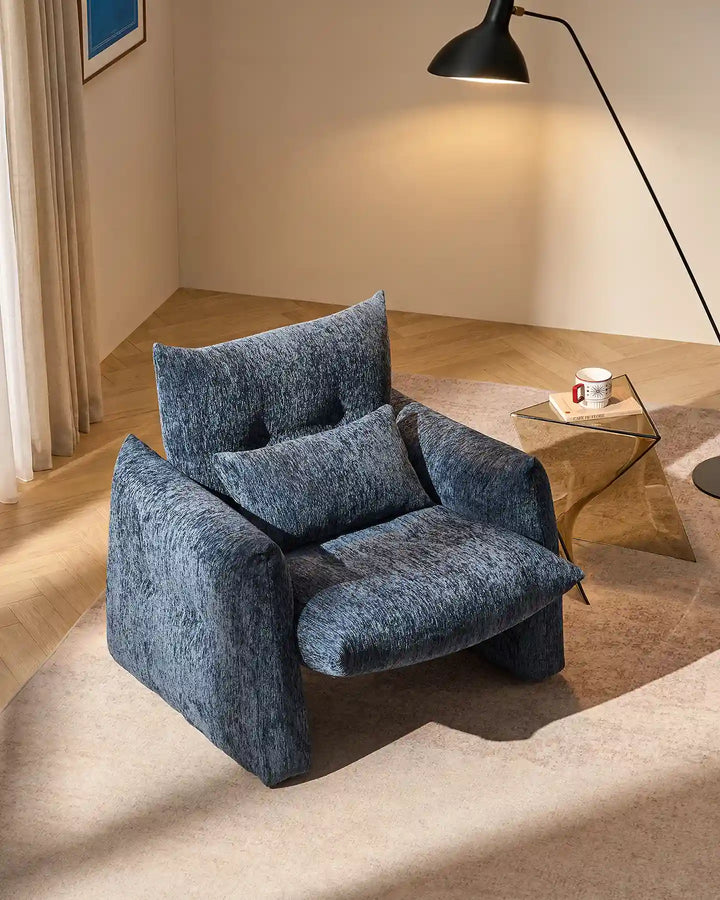 Navy Blue Kumo Accent Chair viewed from above in a modern living room with relaxed lounge seating