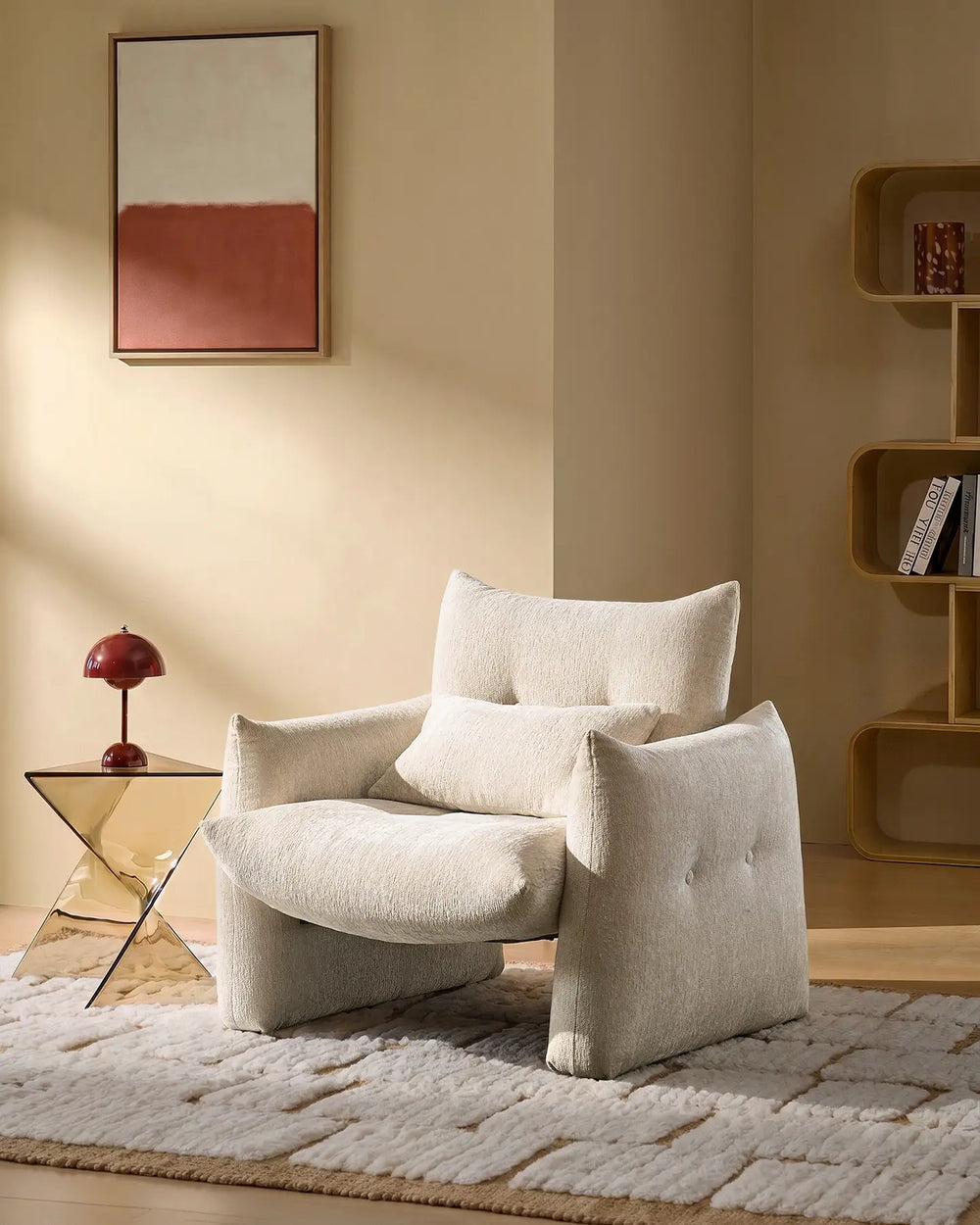 Cream Kumo Accent Chair in a cosy reading corner with soft chenille upholstery and sculptural modern design