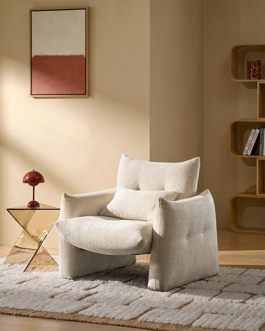 Cream Kumo Accent Chair in a cosy reading corner with soft chenille upholstery and sculptural modern design
