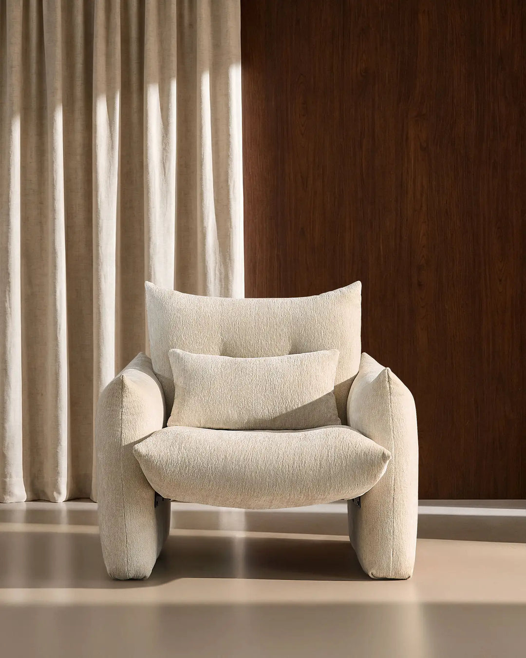 Front view of the cream Kumo Accent Chair with deep cushioning and soft chenille upholstery