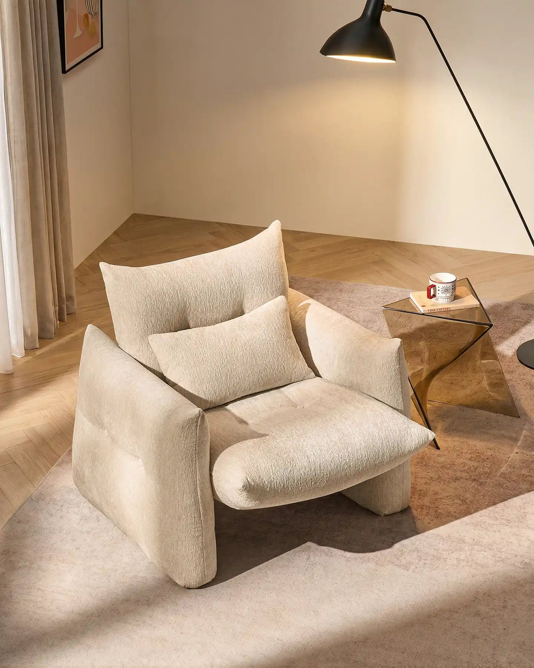 Cream Kumo Accent Chair viewed from above in a bright living room, adding soft modern seating