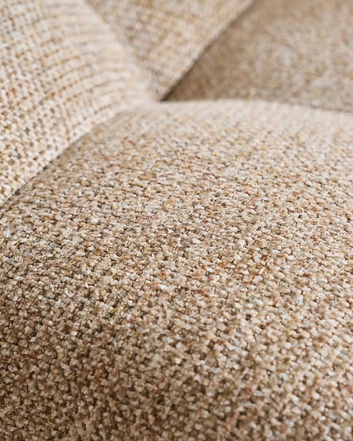Close-up of the Liora khaki swivel vanity stool upholstery showing the woven textured fabric and soft neutral beige tone