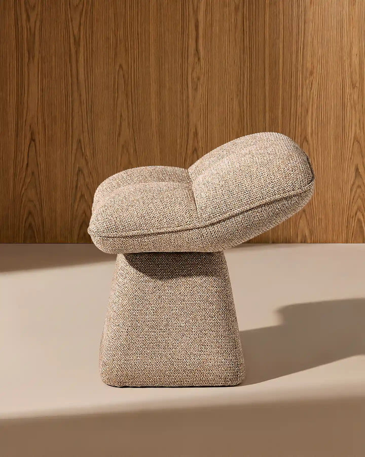 Side view of the Liora khaki swivel vanity stool highlighting its curved seat profile and distinctive sculptural pedestal base