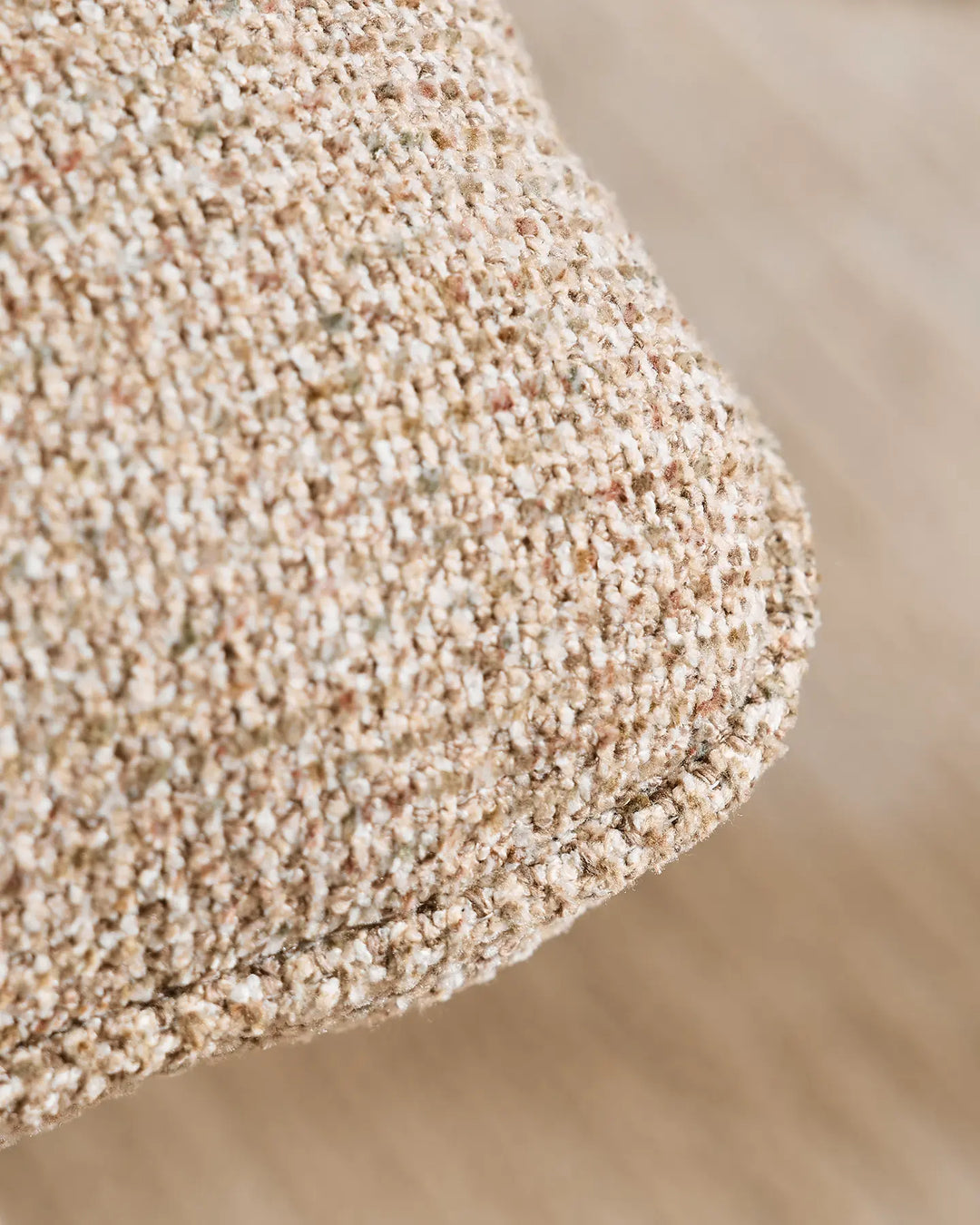 Detailed view of the textured khaki upholstery on the Liora swivel vanity stool, highlighting its tactile woven finish