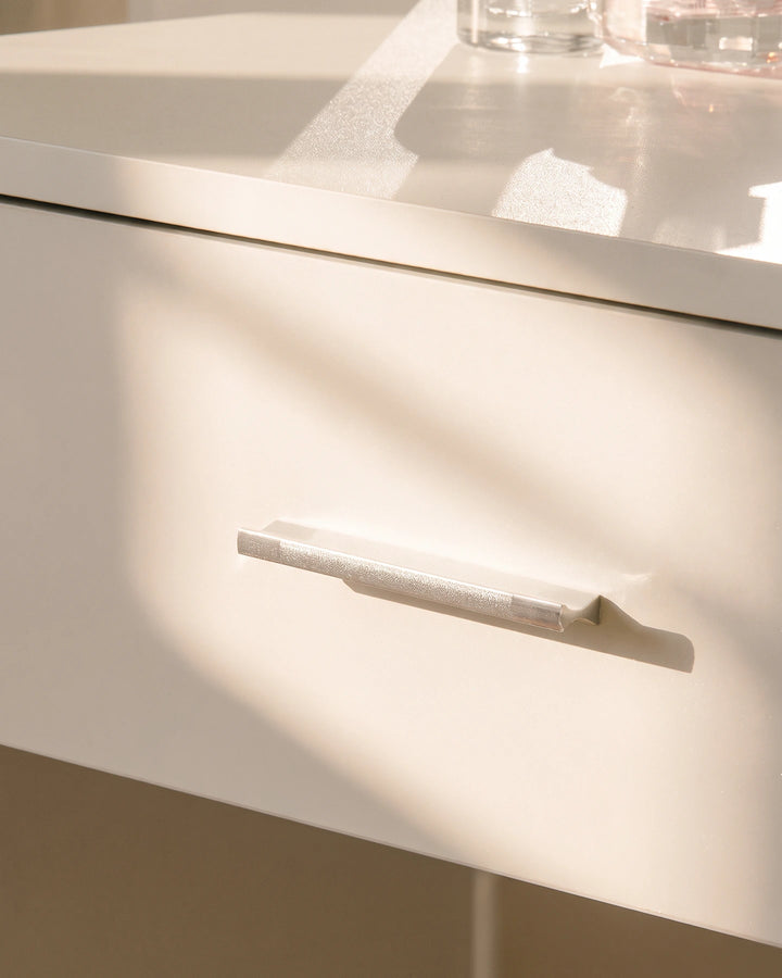 Close-up of the Luna dressing table drawer with a sleek handle and smooth white finish.