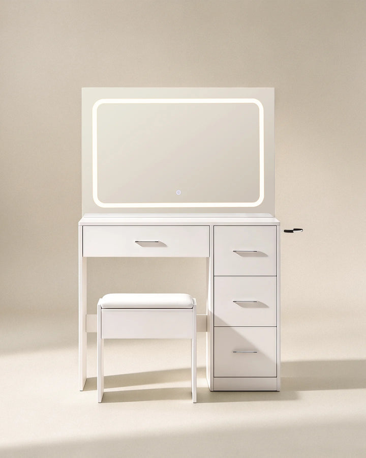 Front view of the Luna white dressing table set with illuminated rectangular mirror, compact drawer storage and matching stool against a neutral background.