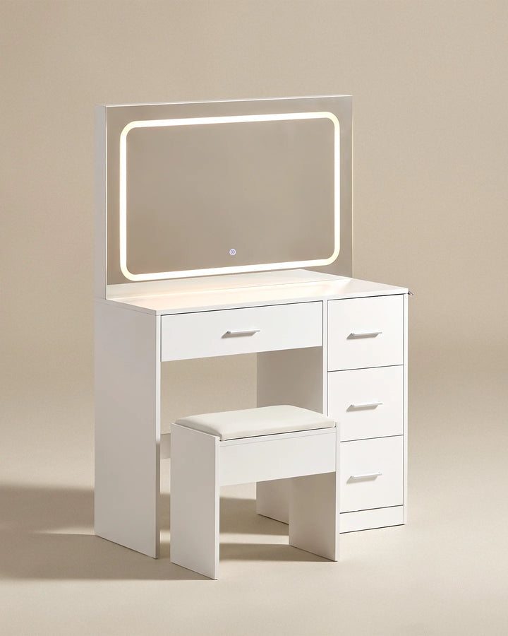 Three-quarter view of the Luna white dressing table featuring an illuminated mirror, multiple drawers and a matching stool.
