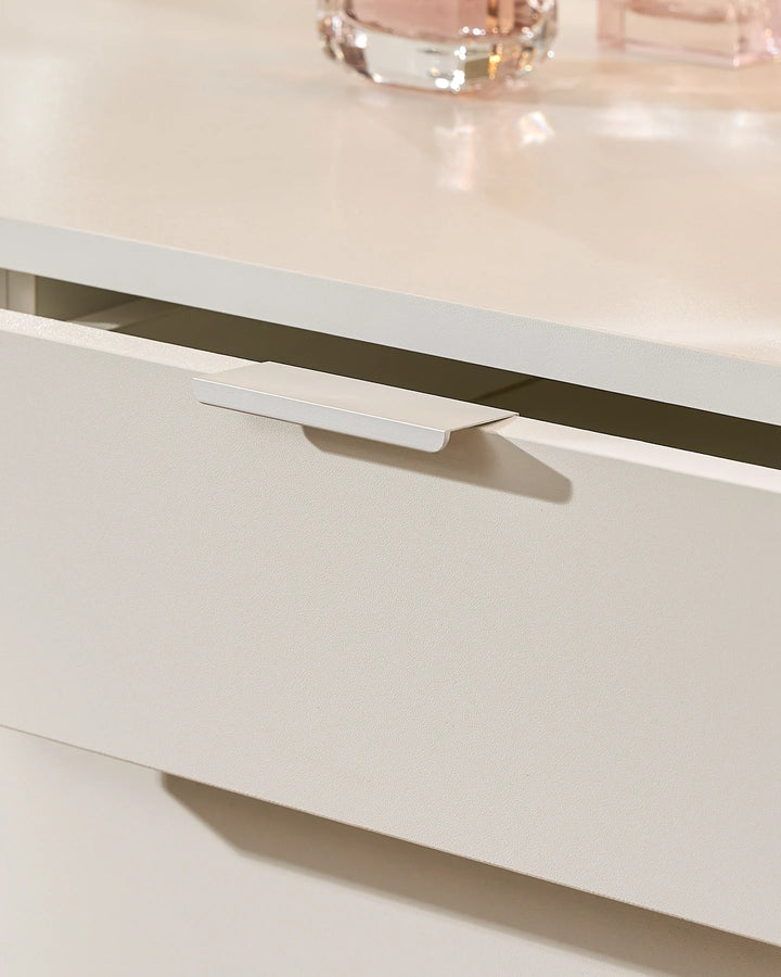 Detail of the Lunea white dressing table drawer with a slim integrated handle and clean, modern drawer-front finish.