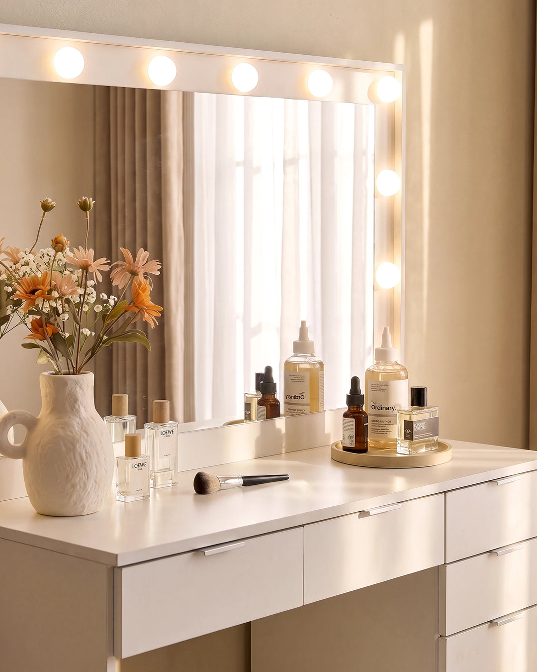 Close-up of the Lunea dressing table mirror with built-in LED bulbs, showcasing the bright vanity lighting and white dressing table surface.
