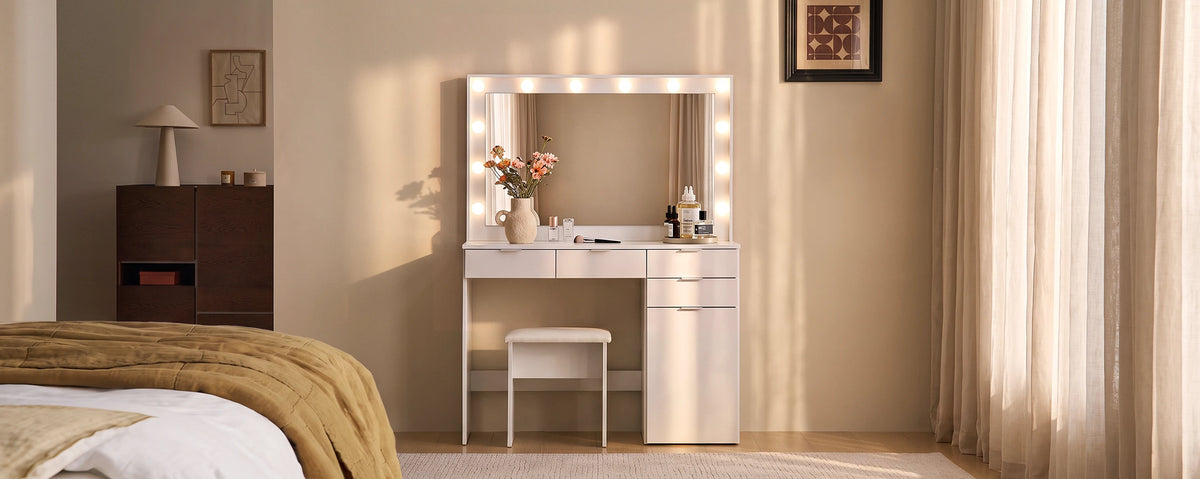 Lunea white dressing table set styled in a warm neutral bedroom, with an illuminated mirror, matching stool and soft natural lighting.