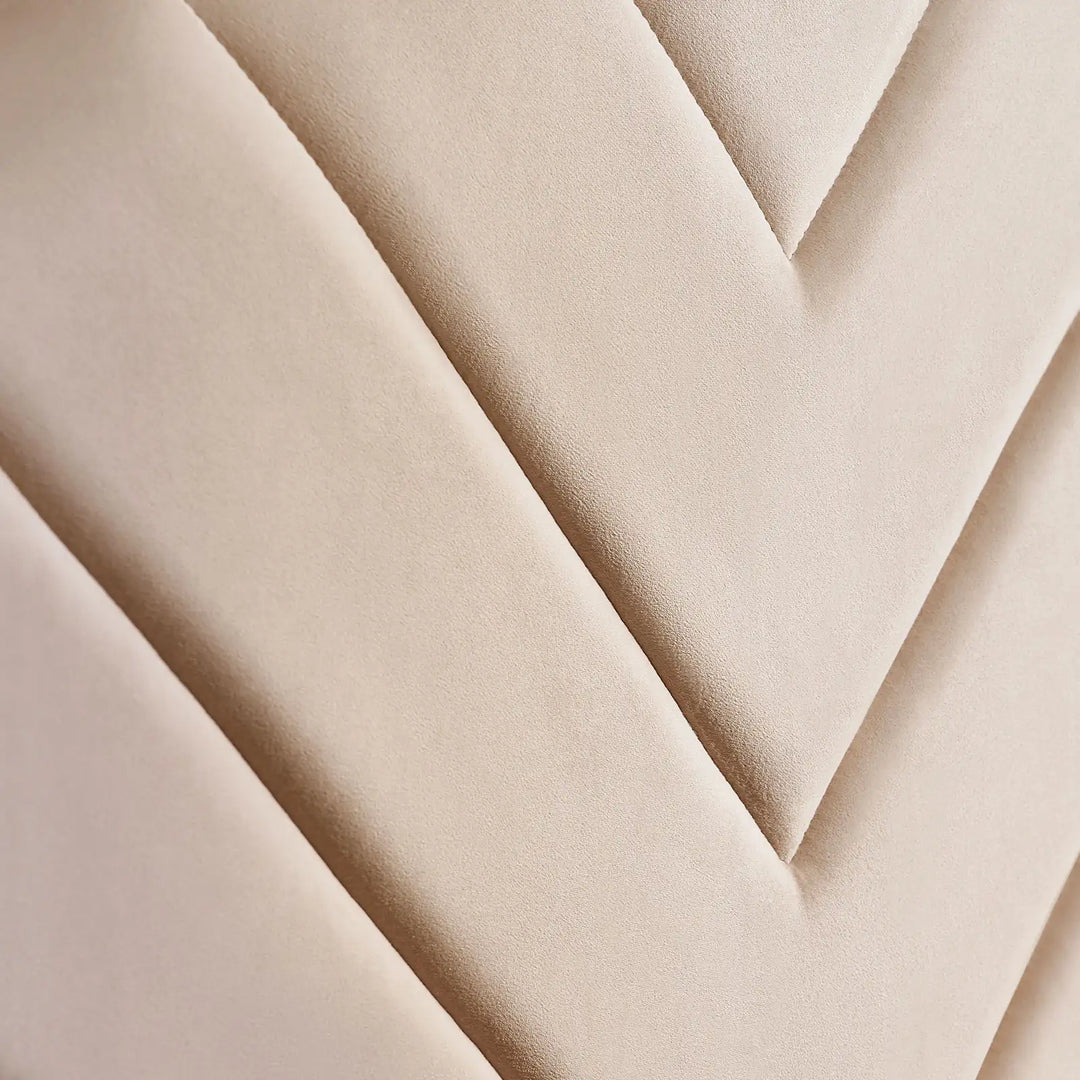 Detailed view of V-stitch pattern on upholstered headboard of double bed frame