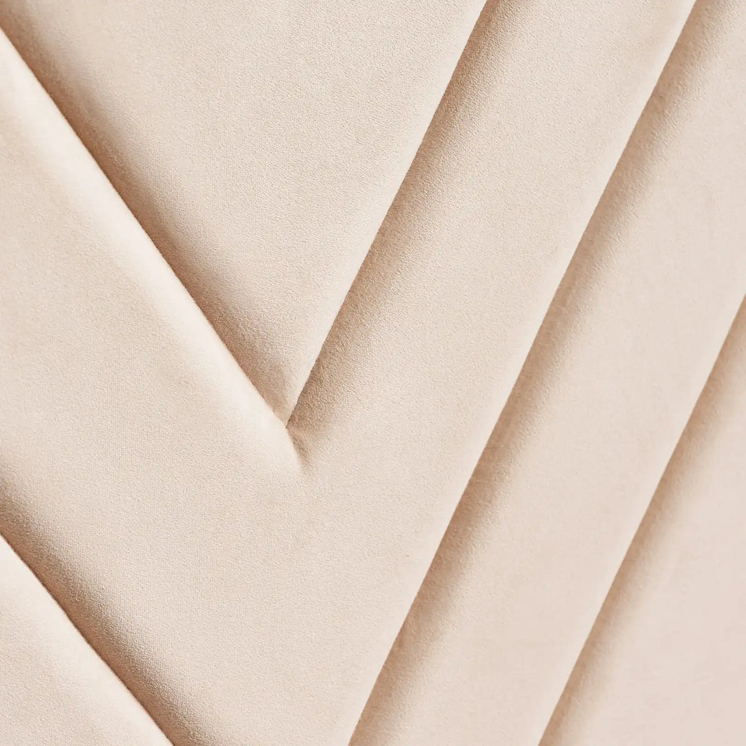 Close-up of the Luniva Cream LED bed’s cream velvet fabric