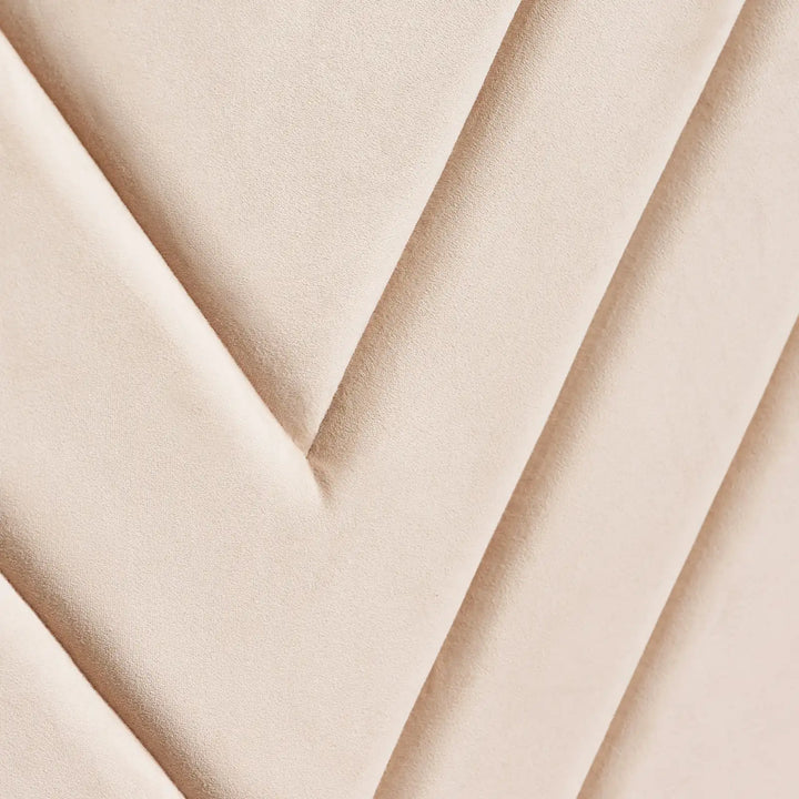 Close-up of the Luniva Cream LED bed’s cream velvet fabric