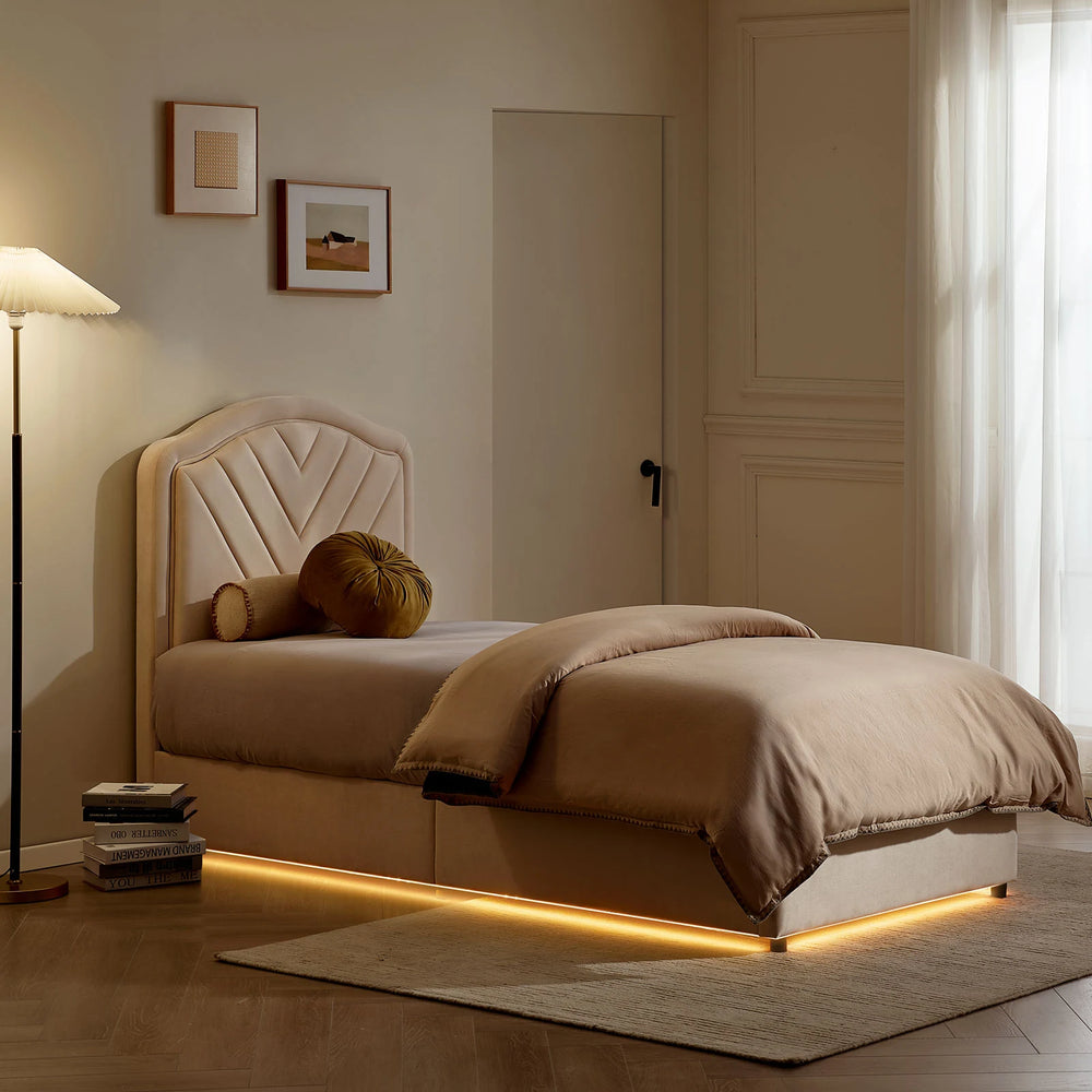 Luniva Cream Single Bed Frame with warm LED lighting in a night-time bedroom