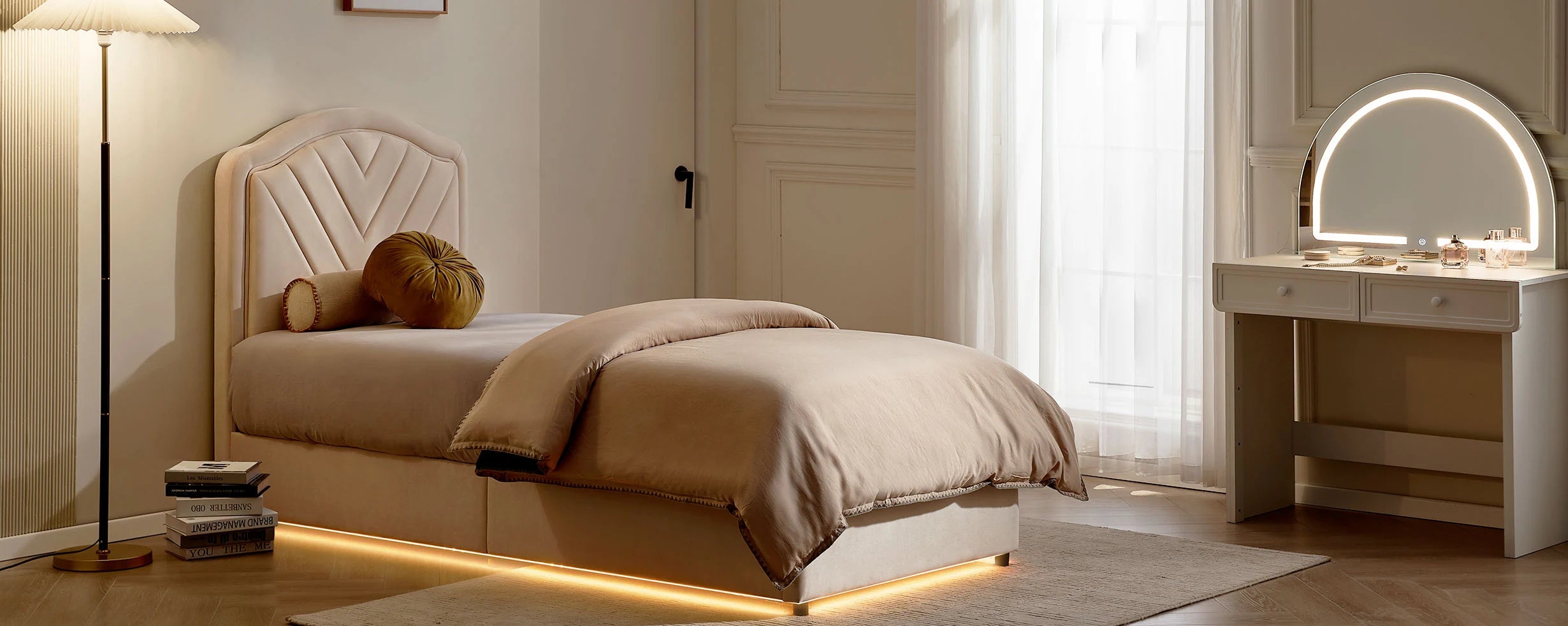 Luniva Cream Single Bed Frame with warm LED lighting in an evening bedroom with a dressing table
