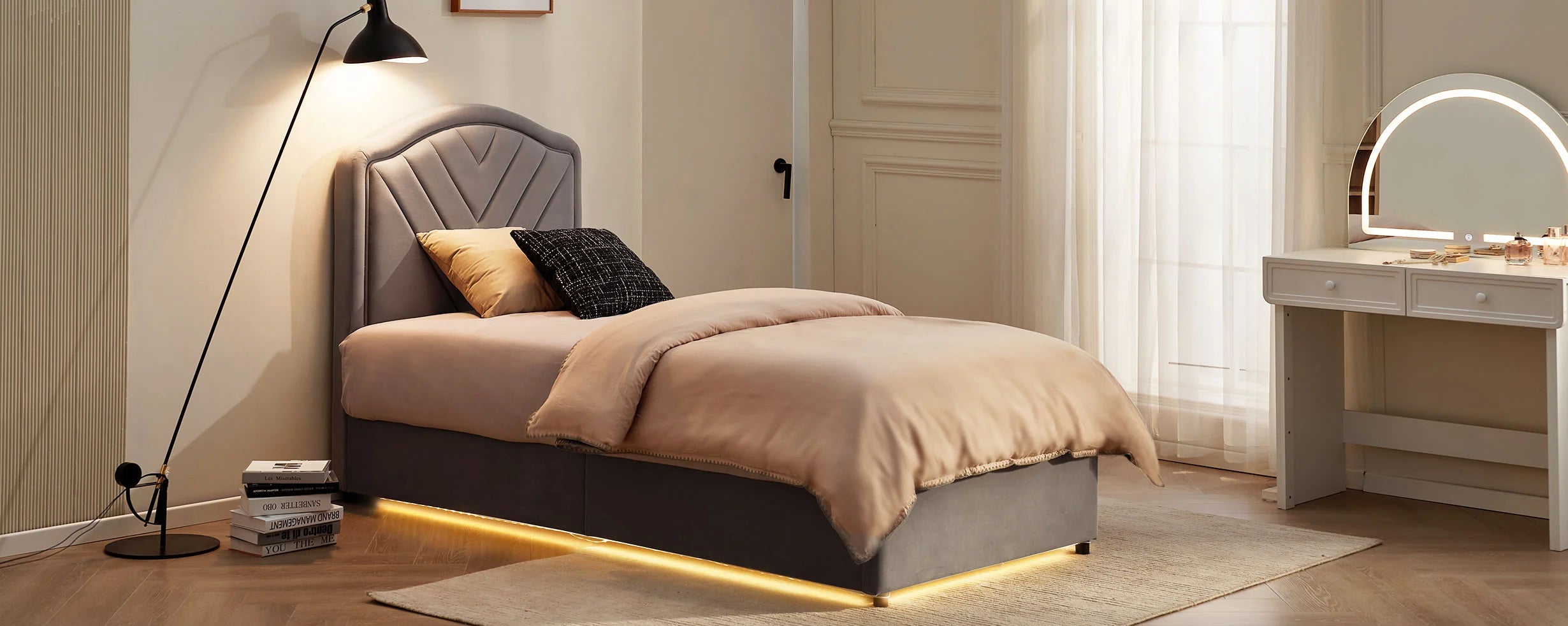Luniva Grey Single Bed Frame with warm LED lighting in an evening bedroom with a dressing table